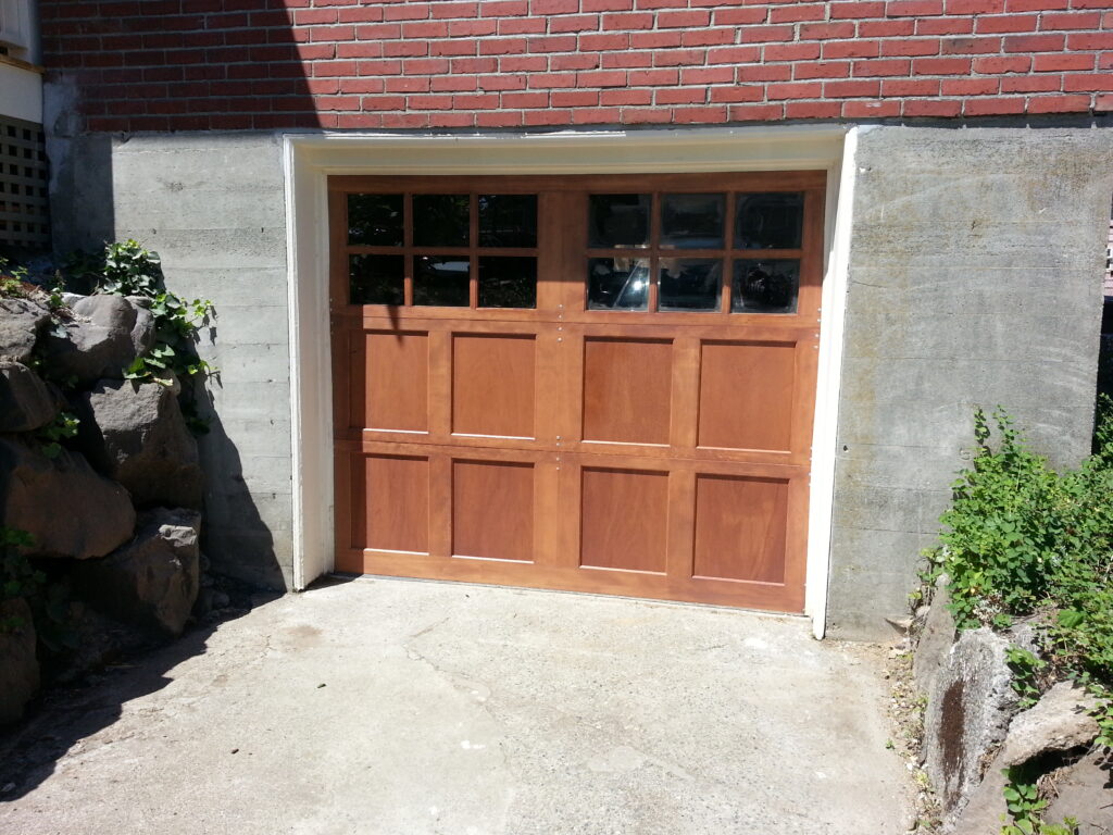 Custom wood garage door with a unique stained finish