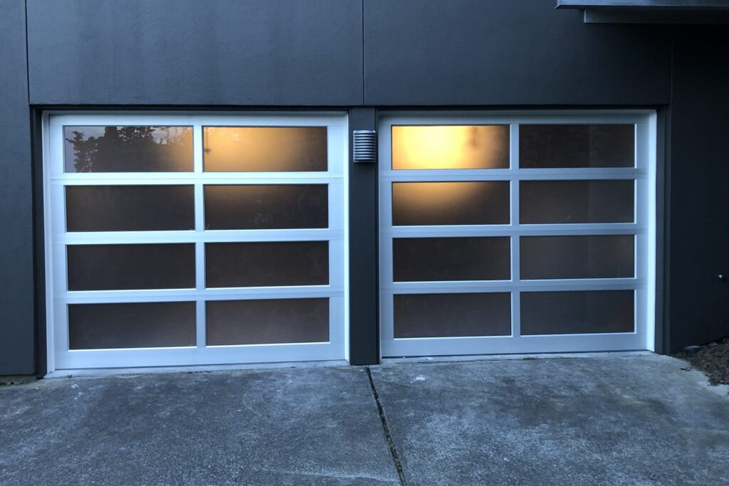 Modern all-glass garage doors after installation in Seattle