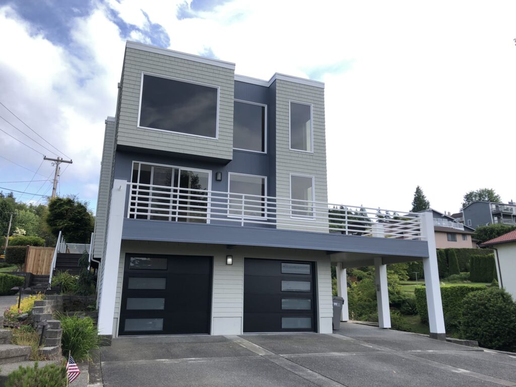 Modern white garage doors after replacement for a Federal Way home