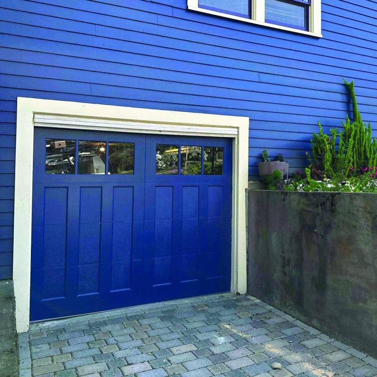 New modern blue garage door installation in Puyallup by Absolute Garage Door experts